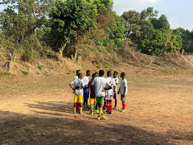 Photo from A Field of Firsts: EKMOI's Children Feed Gbongboma Village