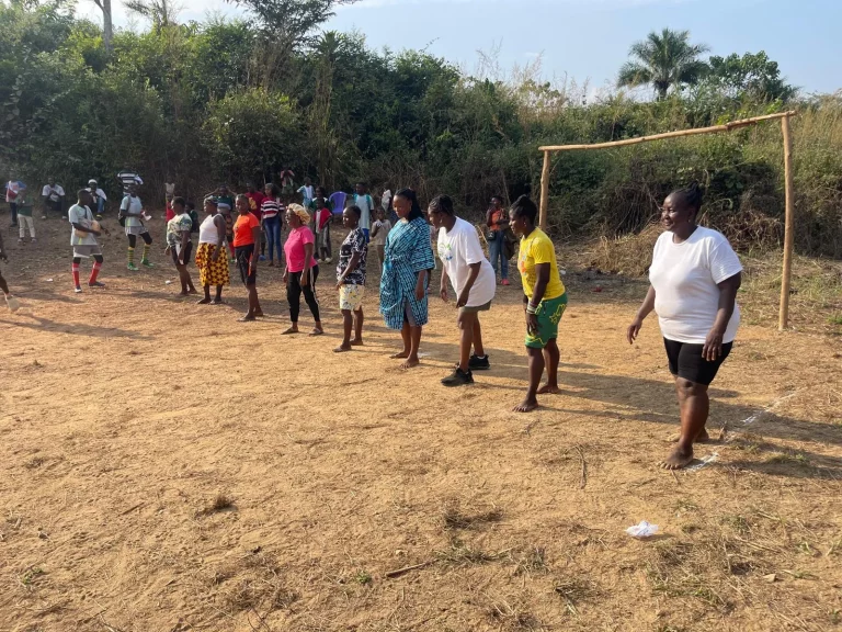 Photo from A Field of Firsts: EKMOI's Children Feed Gbongboma Village